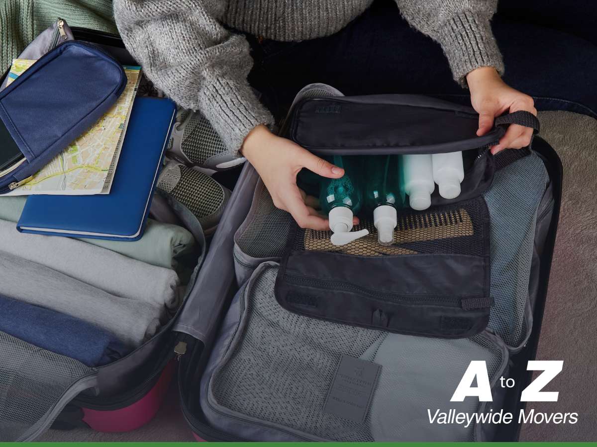 Person using packing cubes & organizers to neatly pack travel essentials